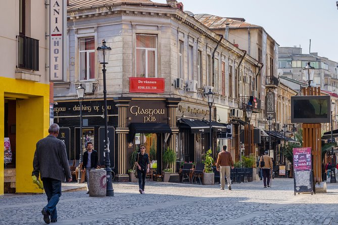 Bucharest Essential Tour: Old Town, Calea Victoriei & Communism - Stop 3: Piaka Revolukiei (Revolution Square) and the brutal reality of control