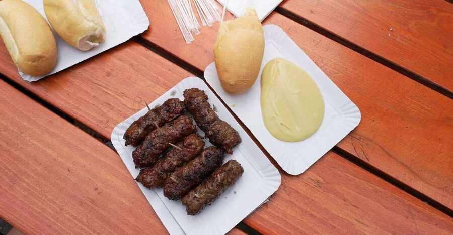 Bucharest: Street Food Tour with a Local Guide - Obor Market tastings: honey, cheese, wooden bowls, and meat rolls