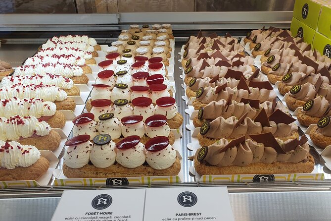 Sweet Delights History and Desserts Walking Tour in Bucharest - Casa Capșa and stepping into a classic cake shop
