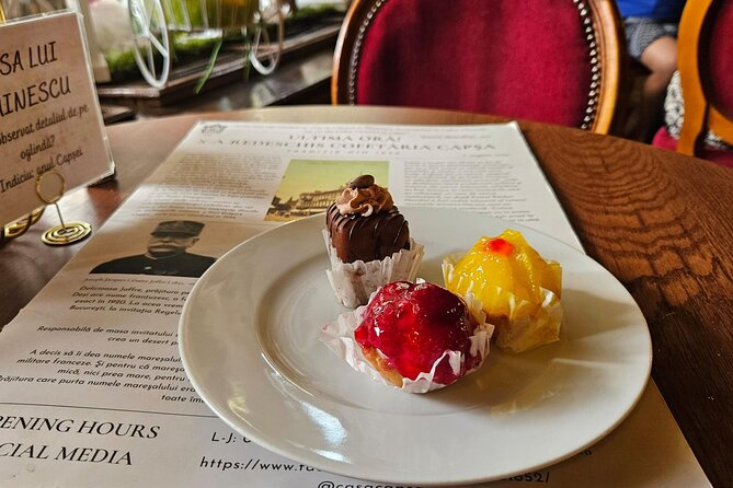 Sweet Delights History and Desserts Walking Tour in Bucharest - Starting at the Romanian Athenaeum, with an eclair in hand